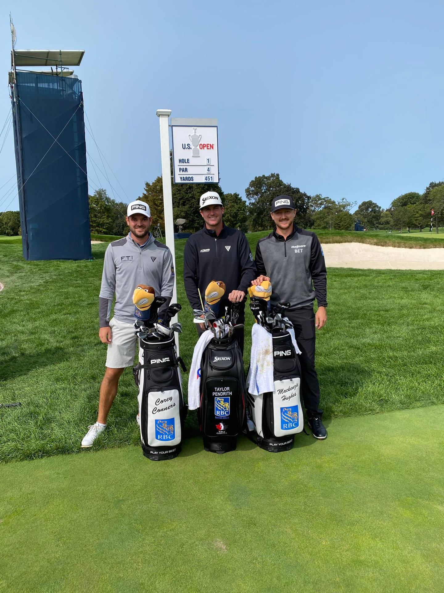 Professional Golfer Corey Conners With Fellow Golfers On The Course Background