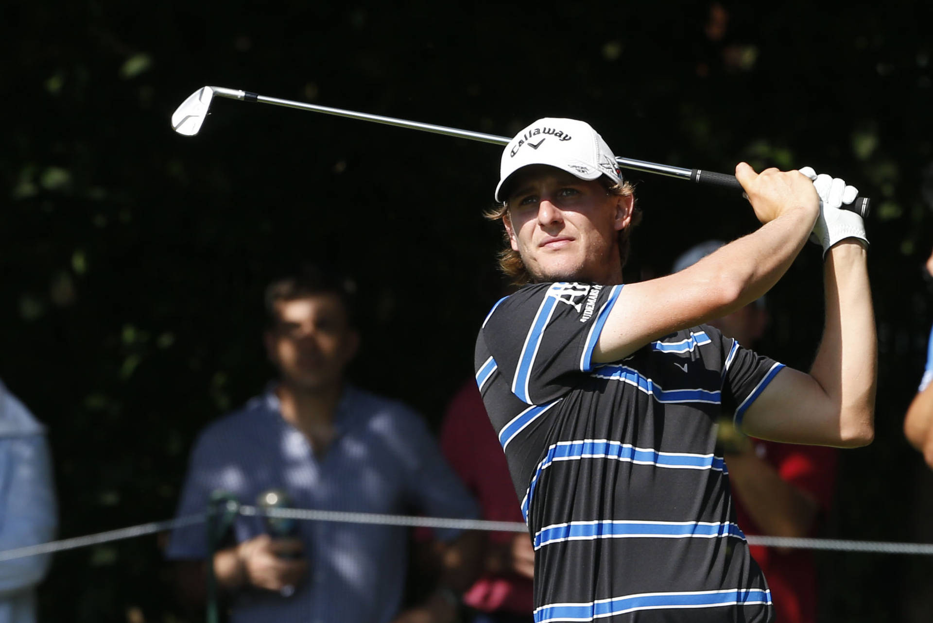 Professional Golfer Emiliano Grillo Analyzing His Shot On The Golf Course Background