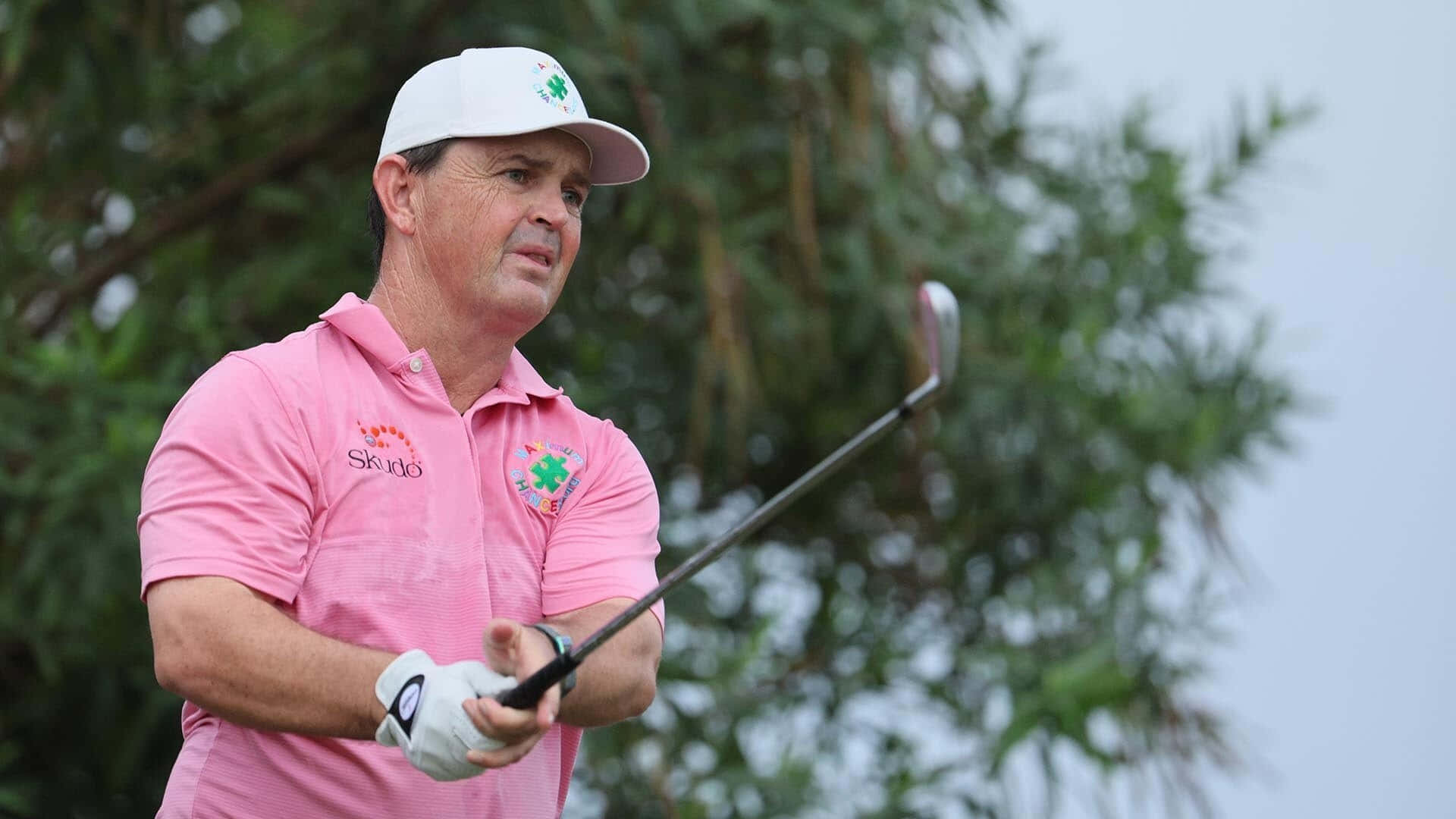 Professional Golfer Greg Chalmers Wearing A Pink Collared Shirt Background
