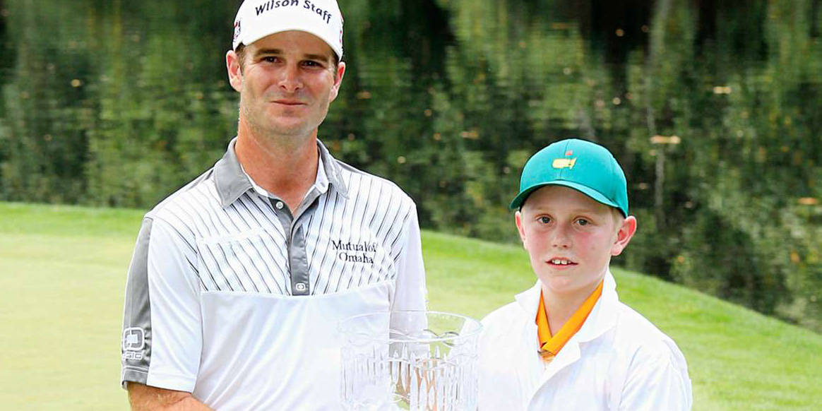 Professional Golfer Kevin Streelman With His Caddie Ethan Couch On The Golf Course. Background