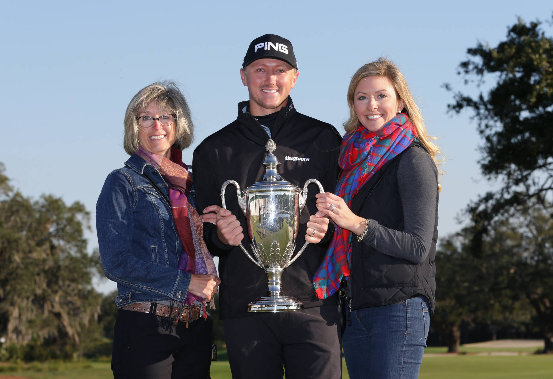 Professional Golfer Mackenzie Hughes With His Mother And Wife Background