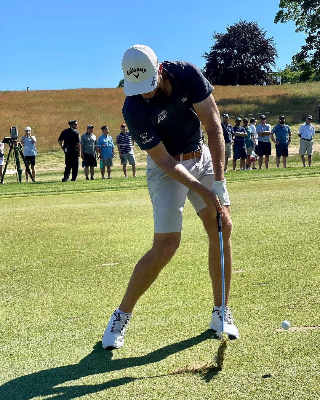 Professional Golfer, Sam Burns, In Perfect Golf Impact Stance Background