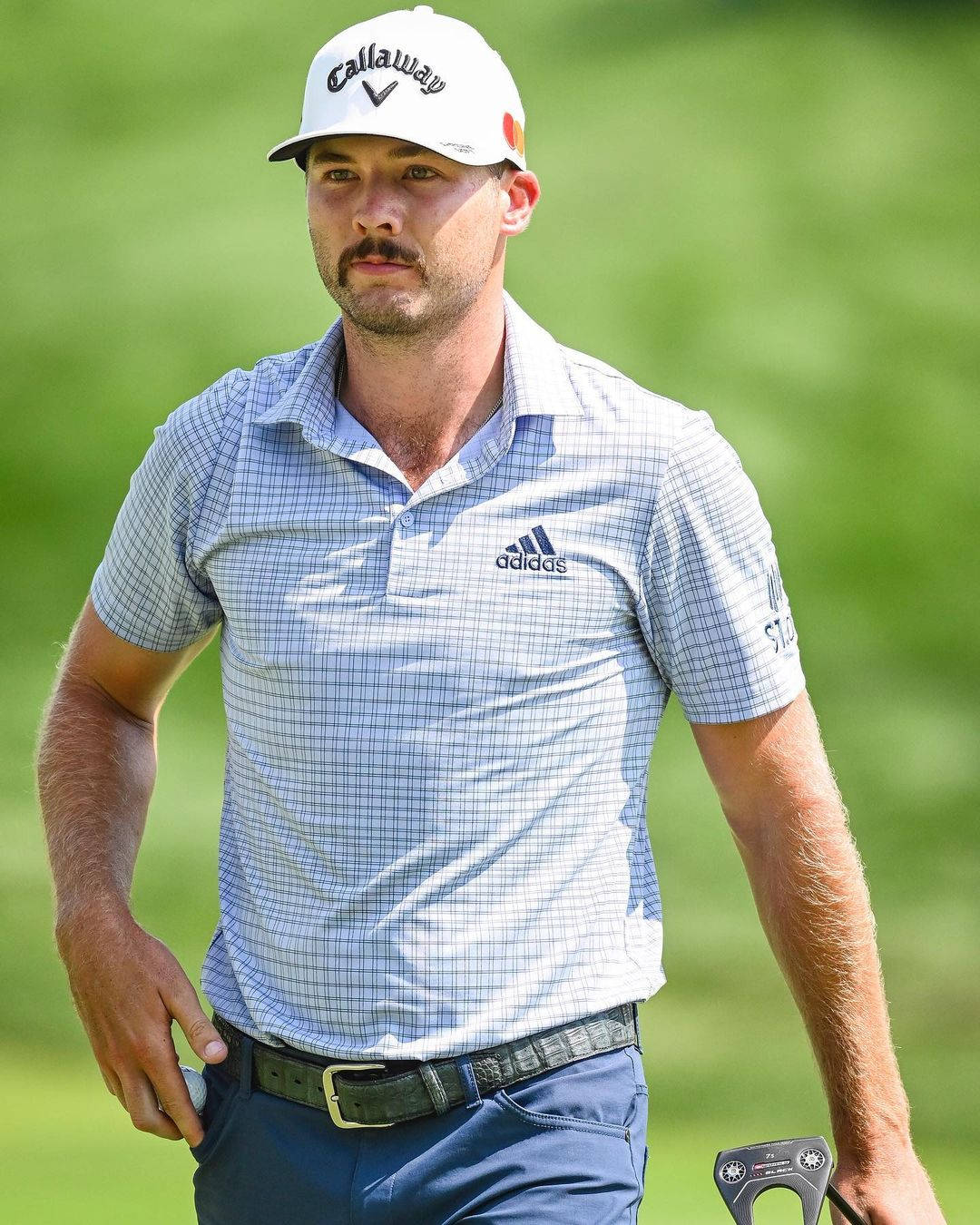 Professional Golfer Sam Burns Sporting A Moustache Background