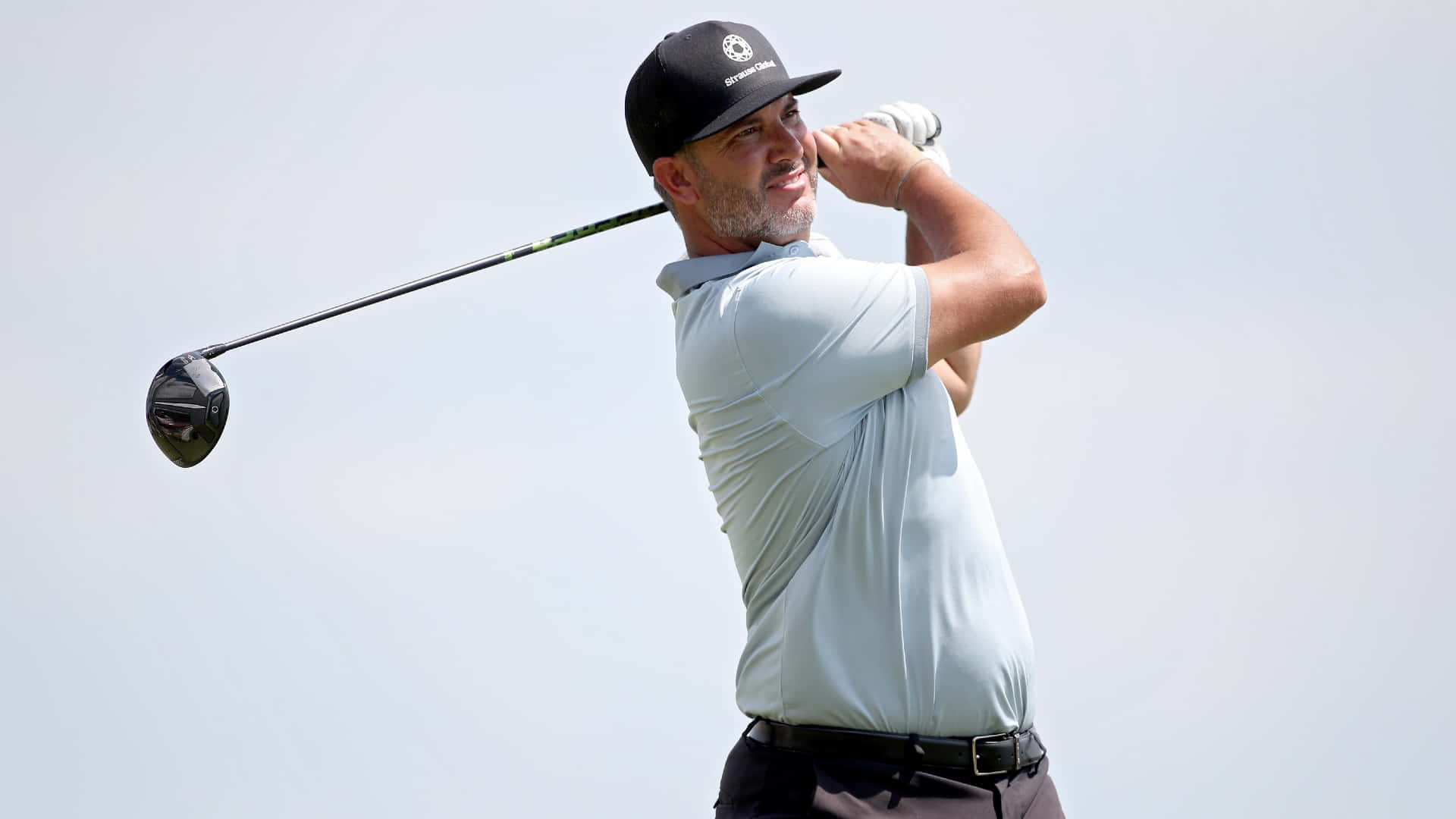 Professional Golfer, Scott Piercy, Posing Against A Grey Backdrop. Background