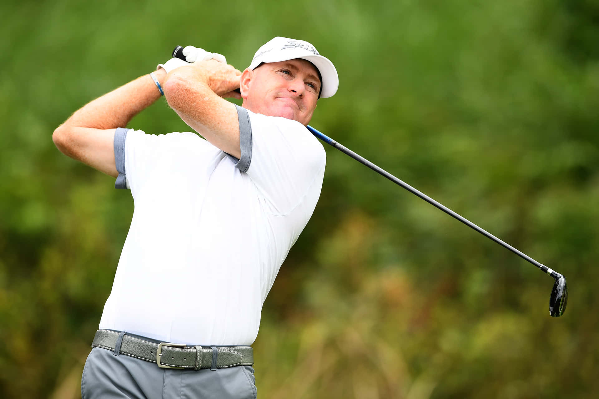 Professional Golfer Steve Flesch In Mid-swing Background