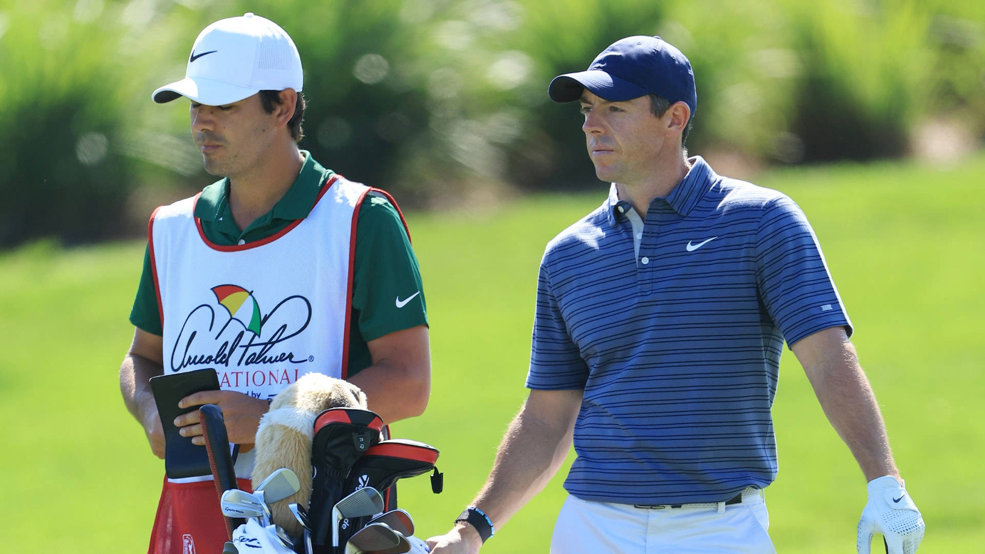 Professional Golfers Brad Faxon And Rory Mcilroy Background