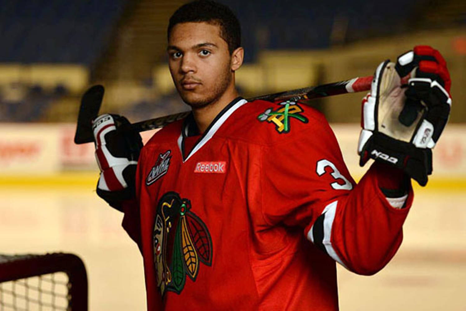 Professional Hockey Player Seth Jones Holding Hockey Stick Background