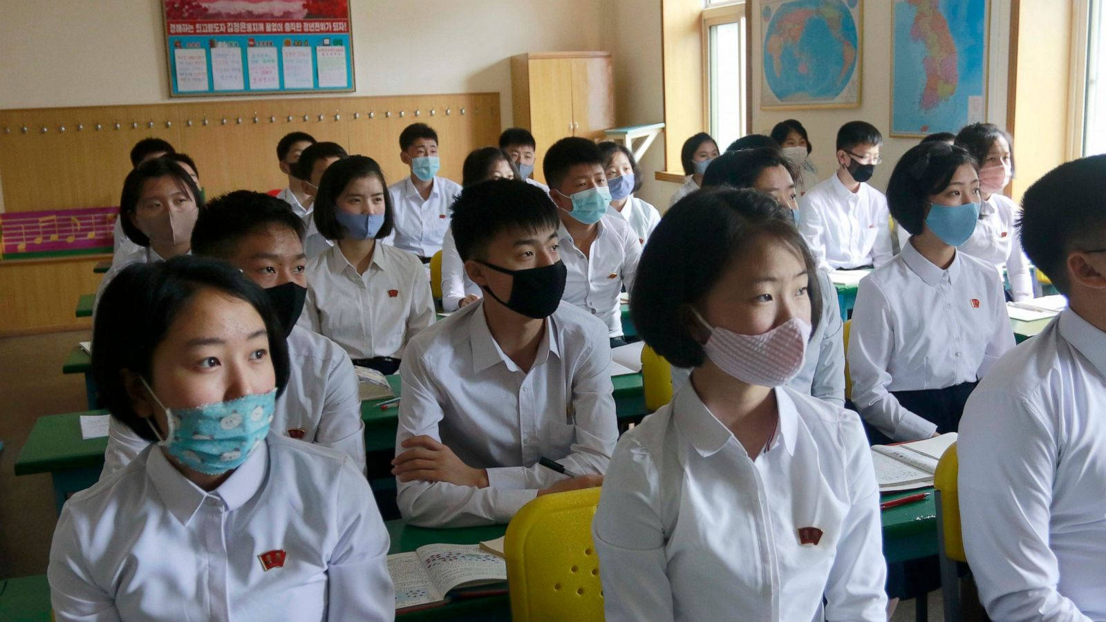 Professional In Medical Protective Gear Holding A Test Kit For Coronavirus Background