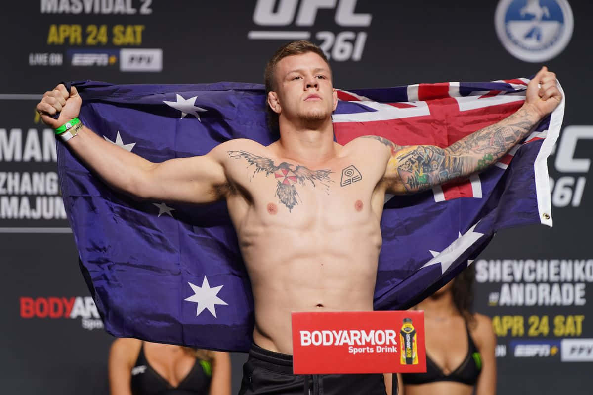 Professional Mma Fighter Jimmy Crute During A Intense Training Session. Background