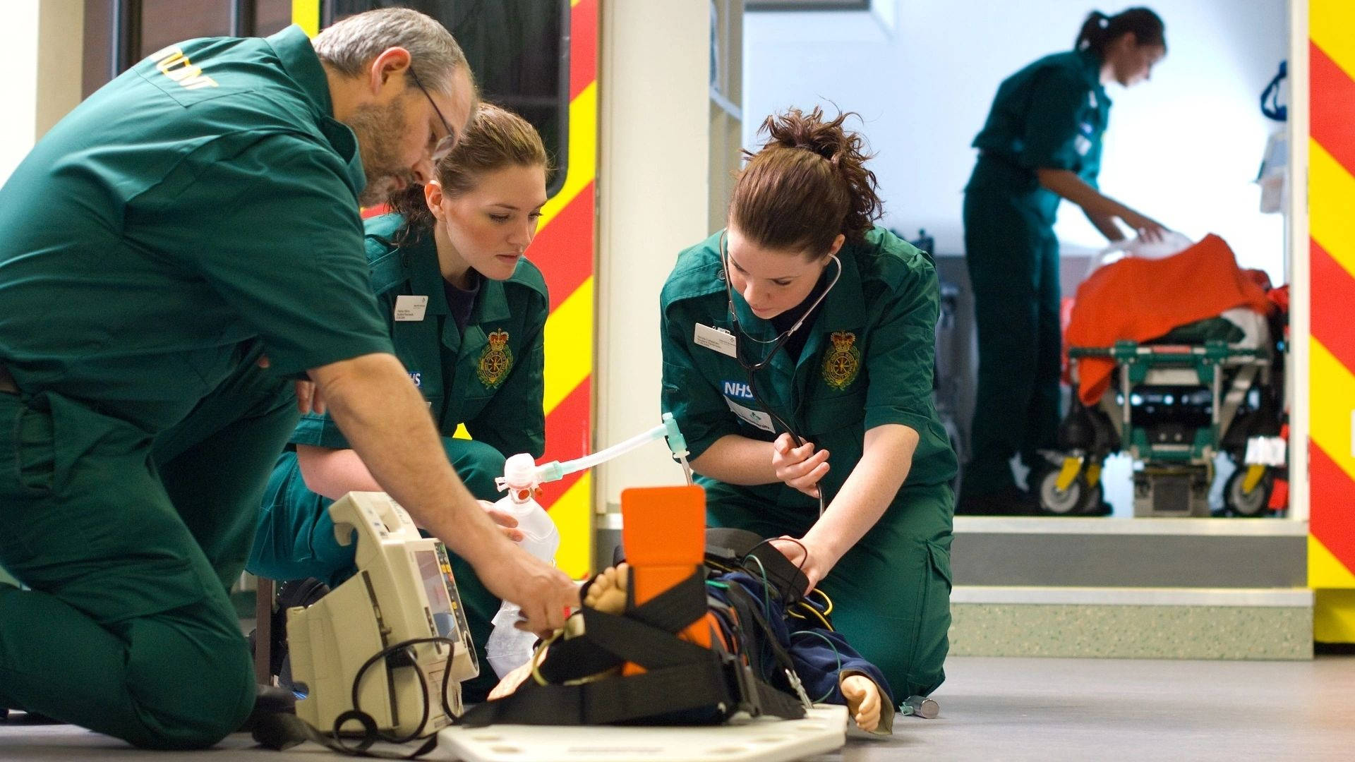 Professional Paramedic Team Providing First Aid Background