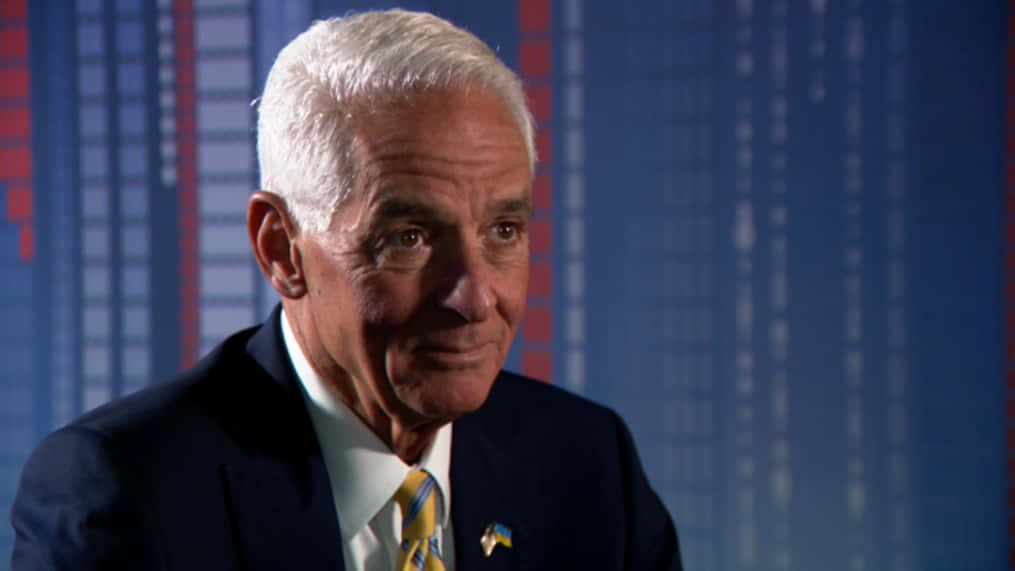 Professional Portrait Of Charlie Crist Against A Blue Background Background