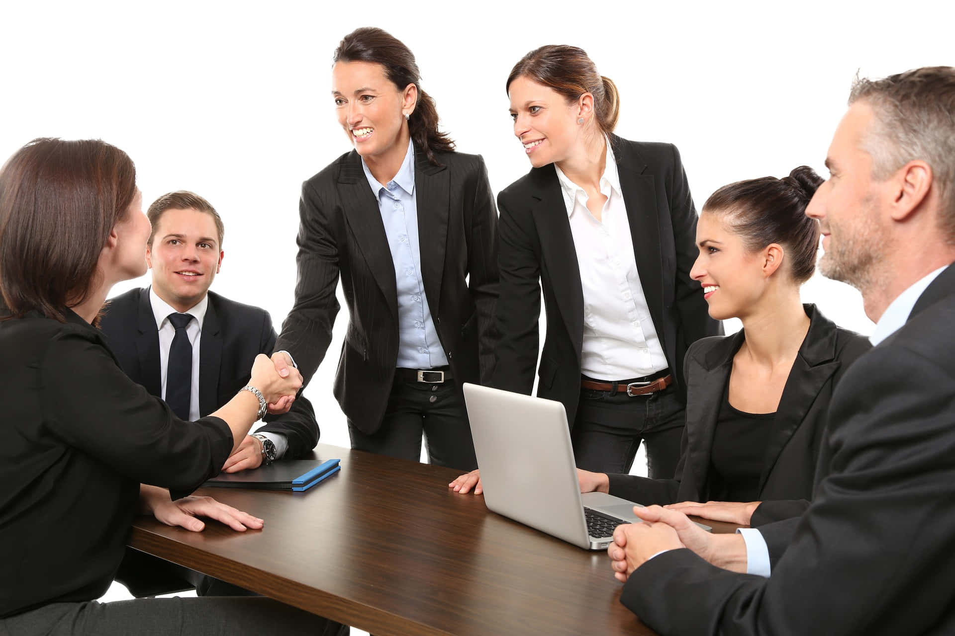 Professional Team Exchanging Ideas And Handshakes Background