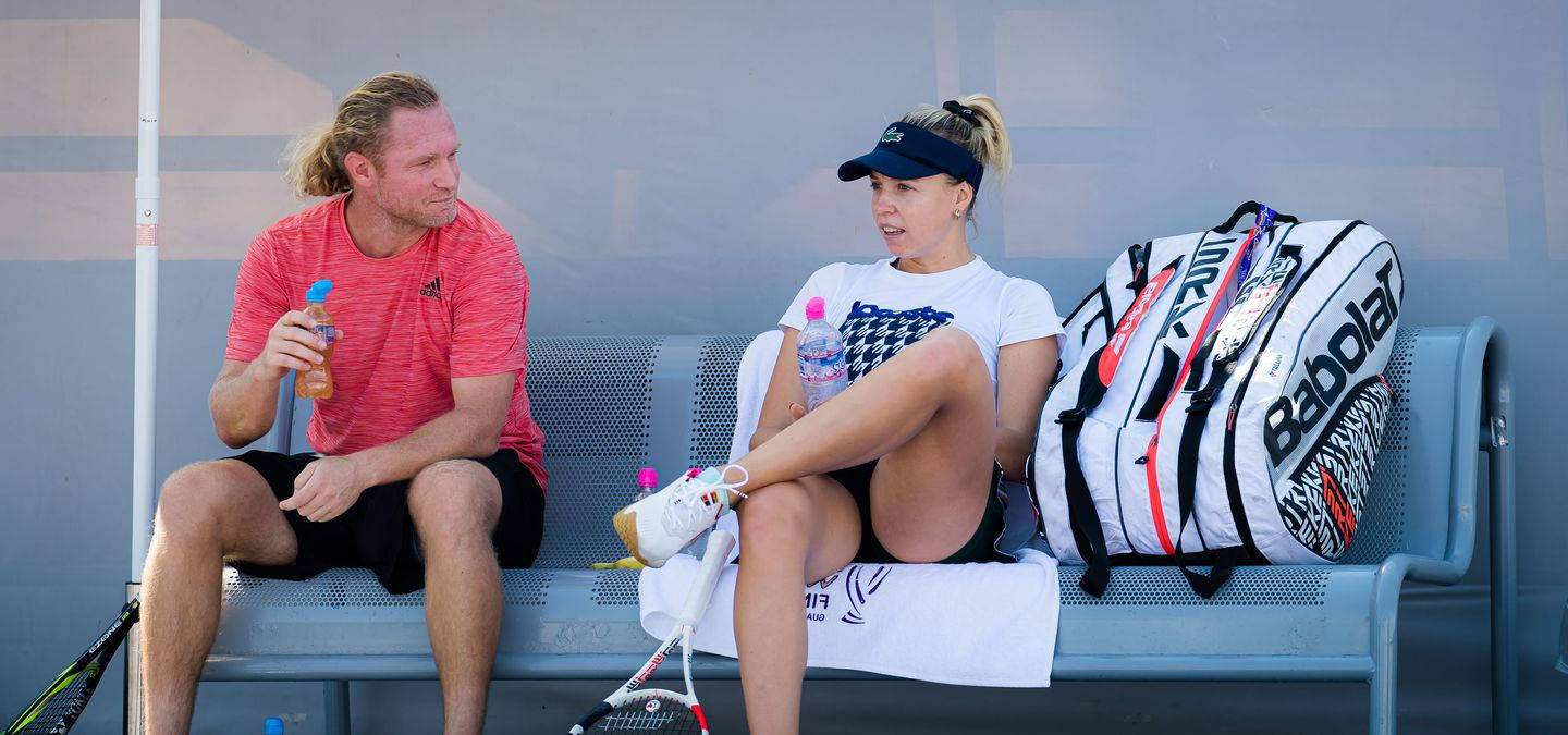 Professional Tennis Player Anett Kontaveit Relaxing Off Court Background