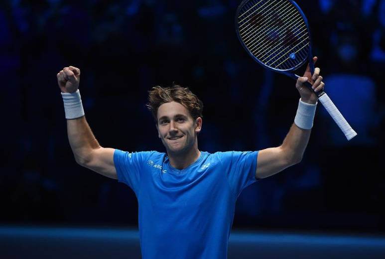 Professional Tennis Player, Casper Ruud, Delivering A Powerful Forehand Stroke. Background