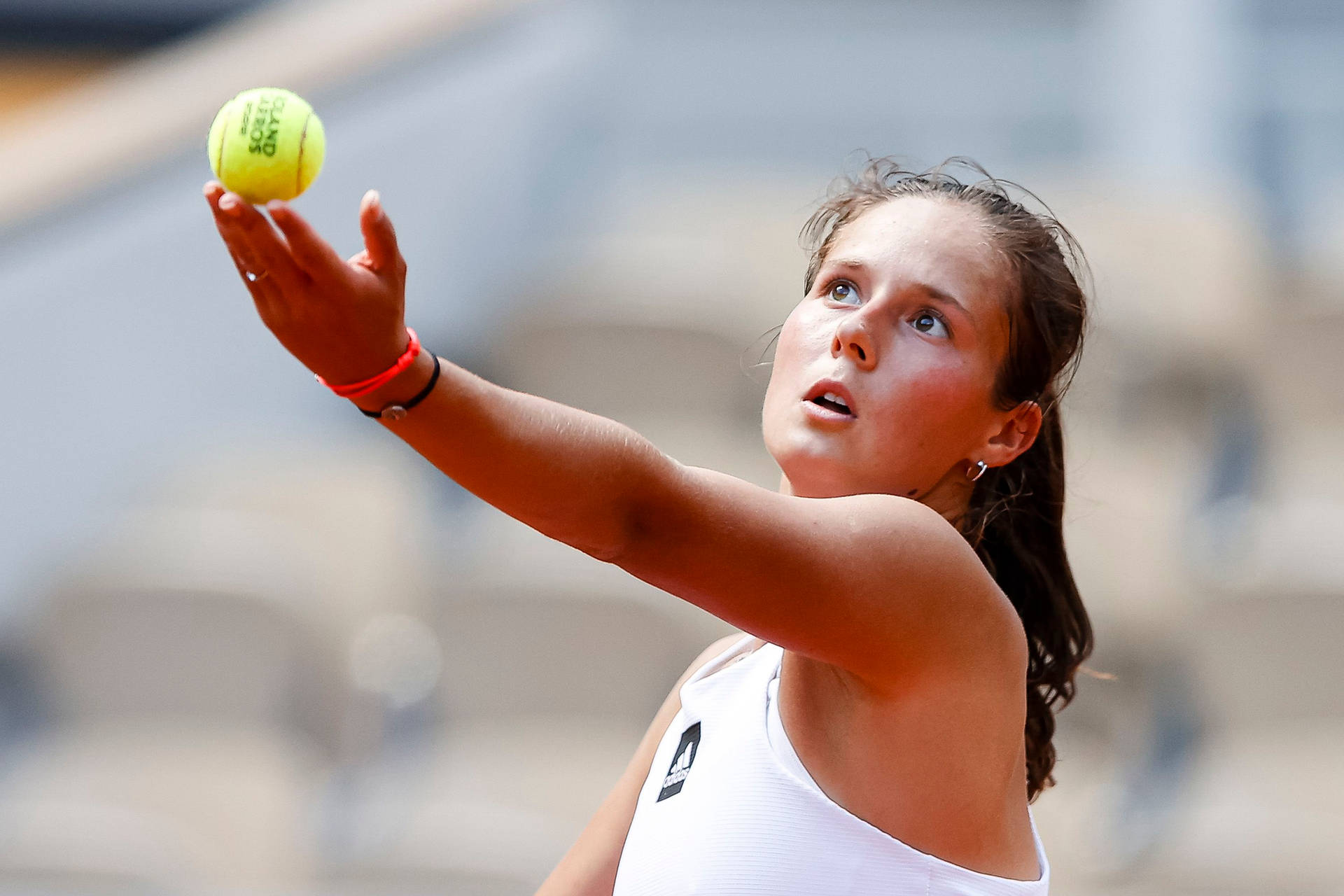 Professional Tennis Player Daria Kasatkina Prepares To Serve Background