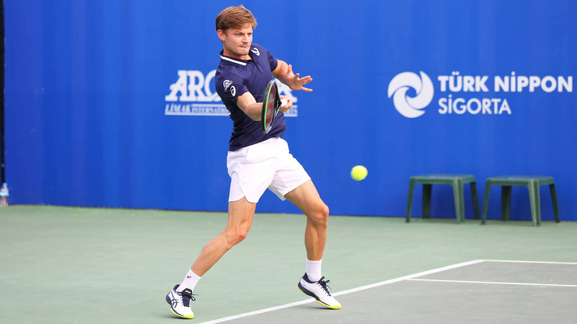 Professional Tennis Player David Goffin In Action On The Court Background