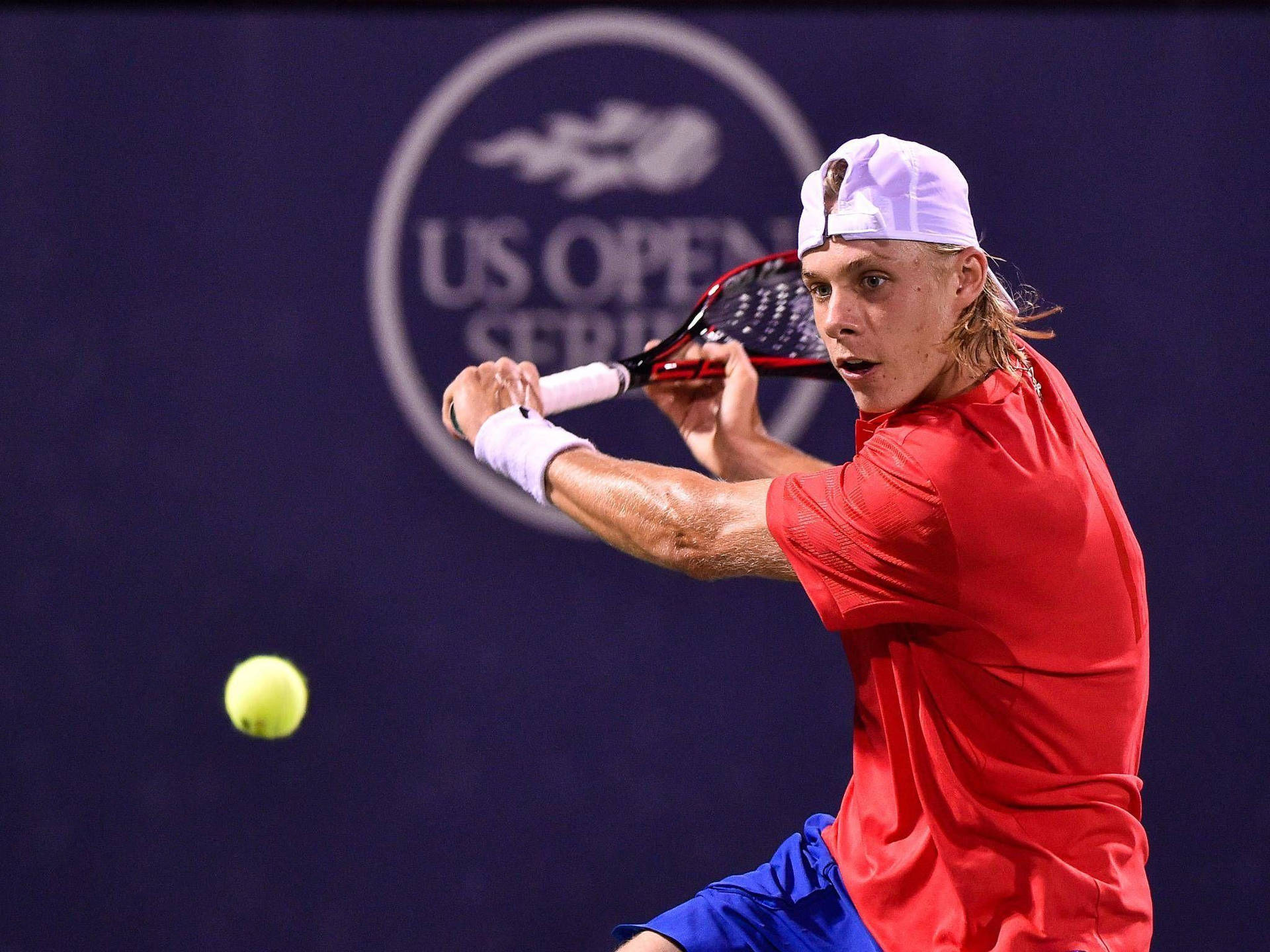 Professional Tennis Player Denis Shapovalov In Action Background