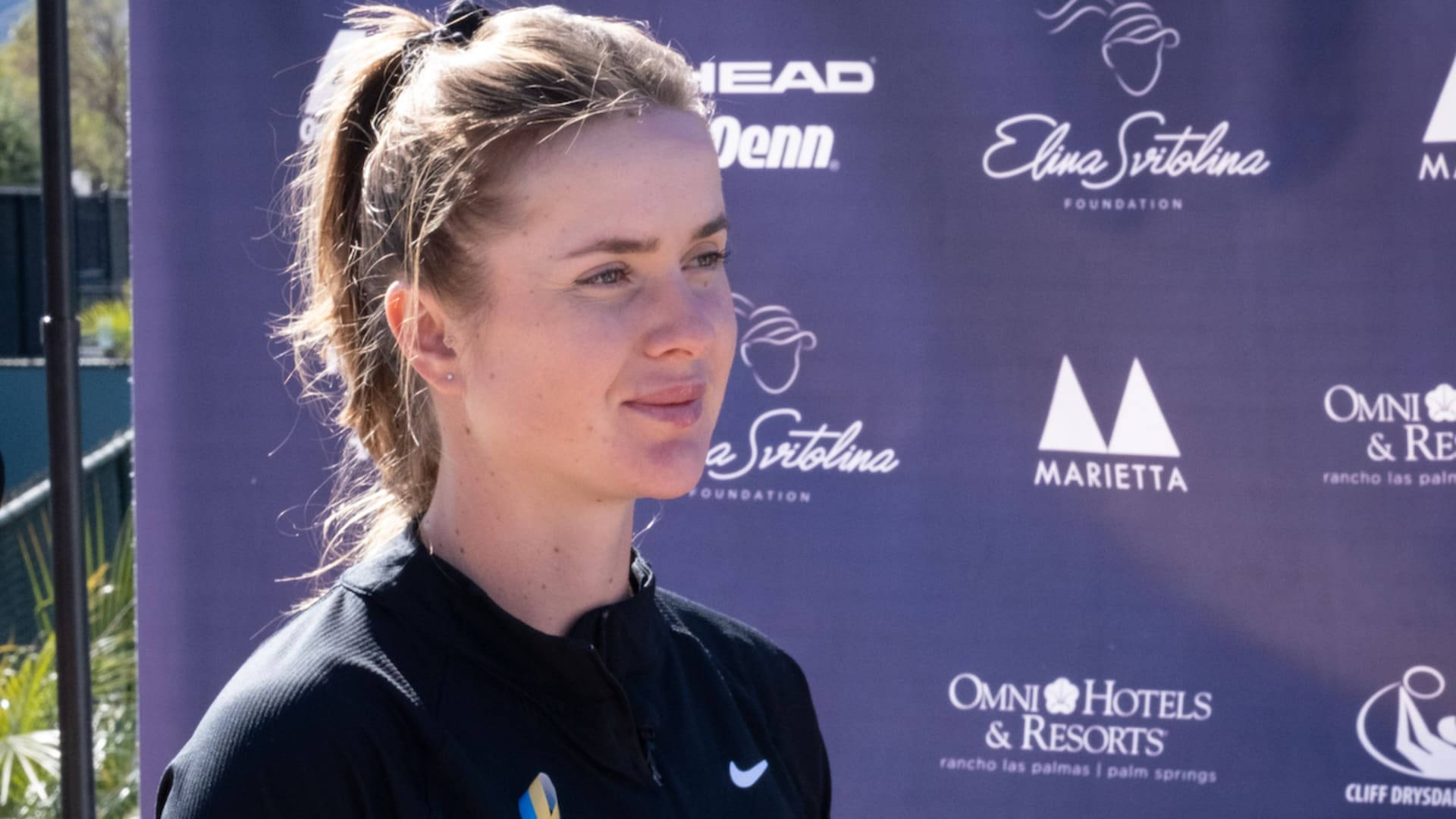 Professional Tennis Player Elina Svitolina Engaging In An Interview Background