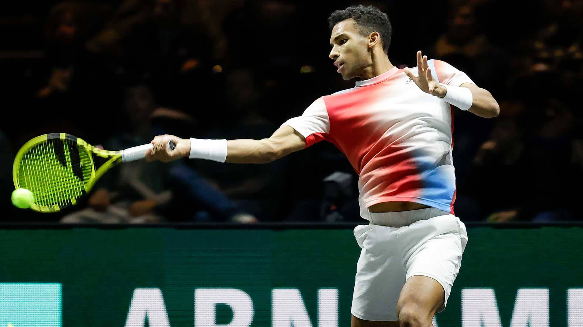 Professional Tennis Player Felix Auger Aliassime Performing A Right Forehand Stroke