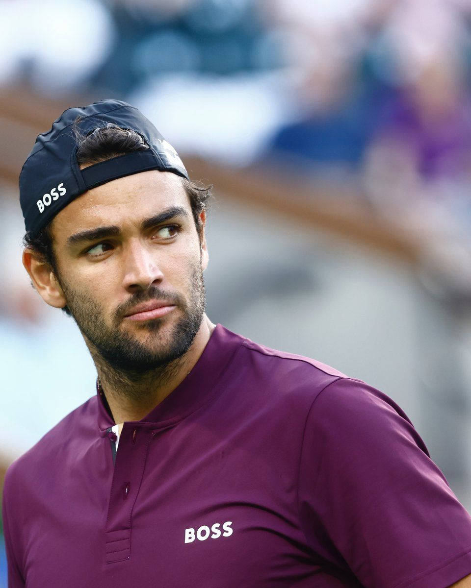 Professional Tennis Player Matteo Berrettini Wearing A Black Cap