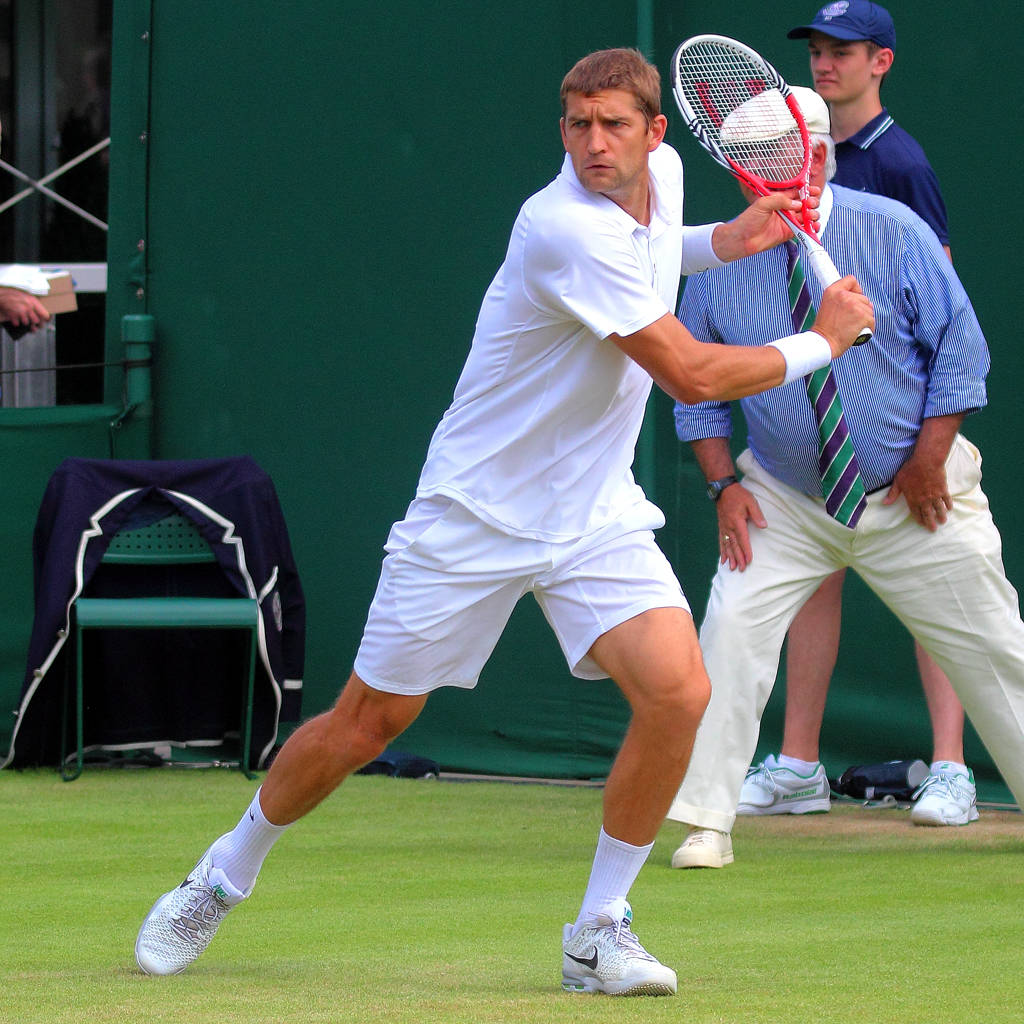 Professional Tennis Player Max Mirnyi In A Powerful Stroke Pose