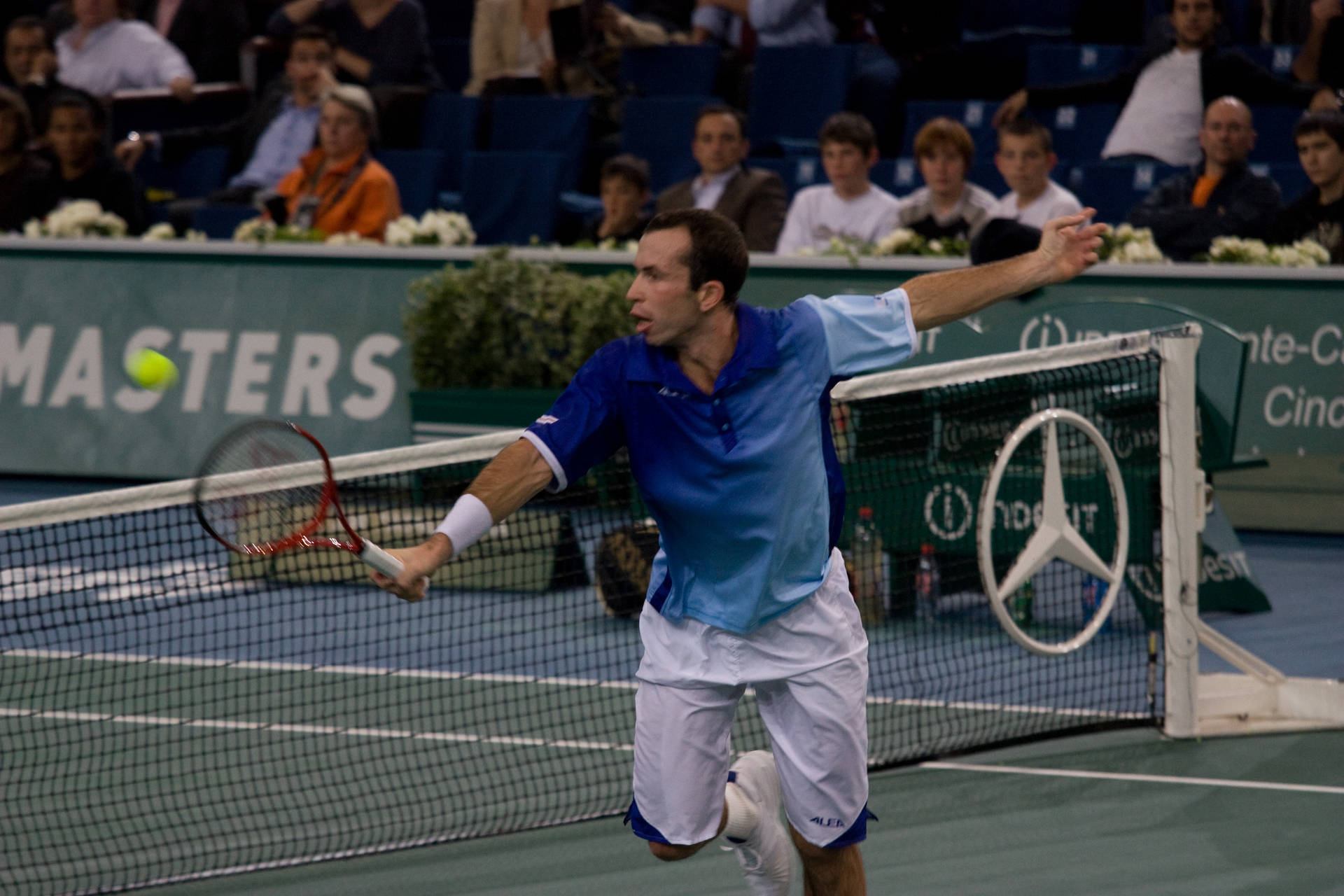 Professional Tennis Player Radek Stepanek Preparing To Return Serve Background