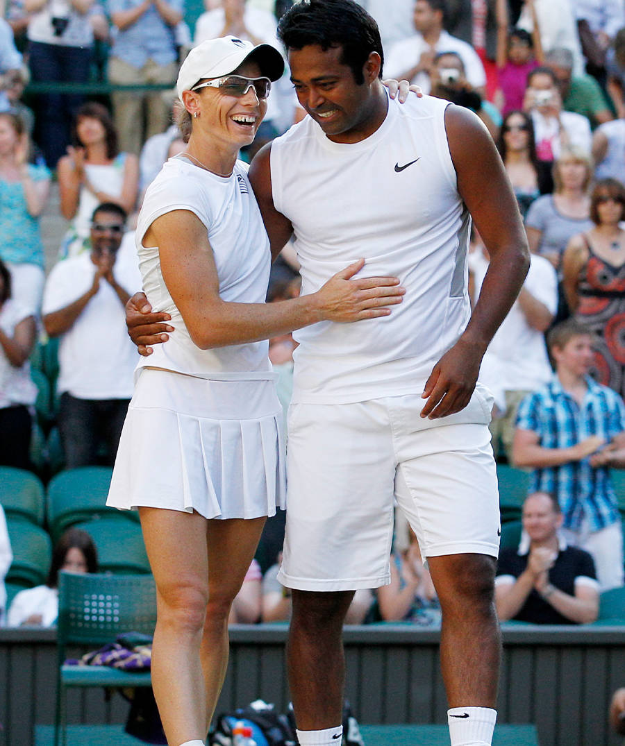 Professional Tennis Players Cara Black And Leander Paes In Action Background