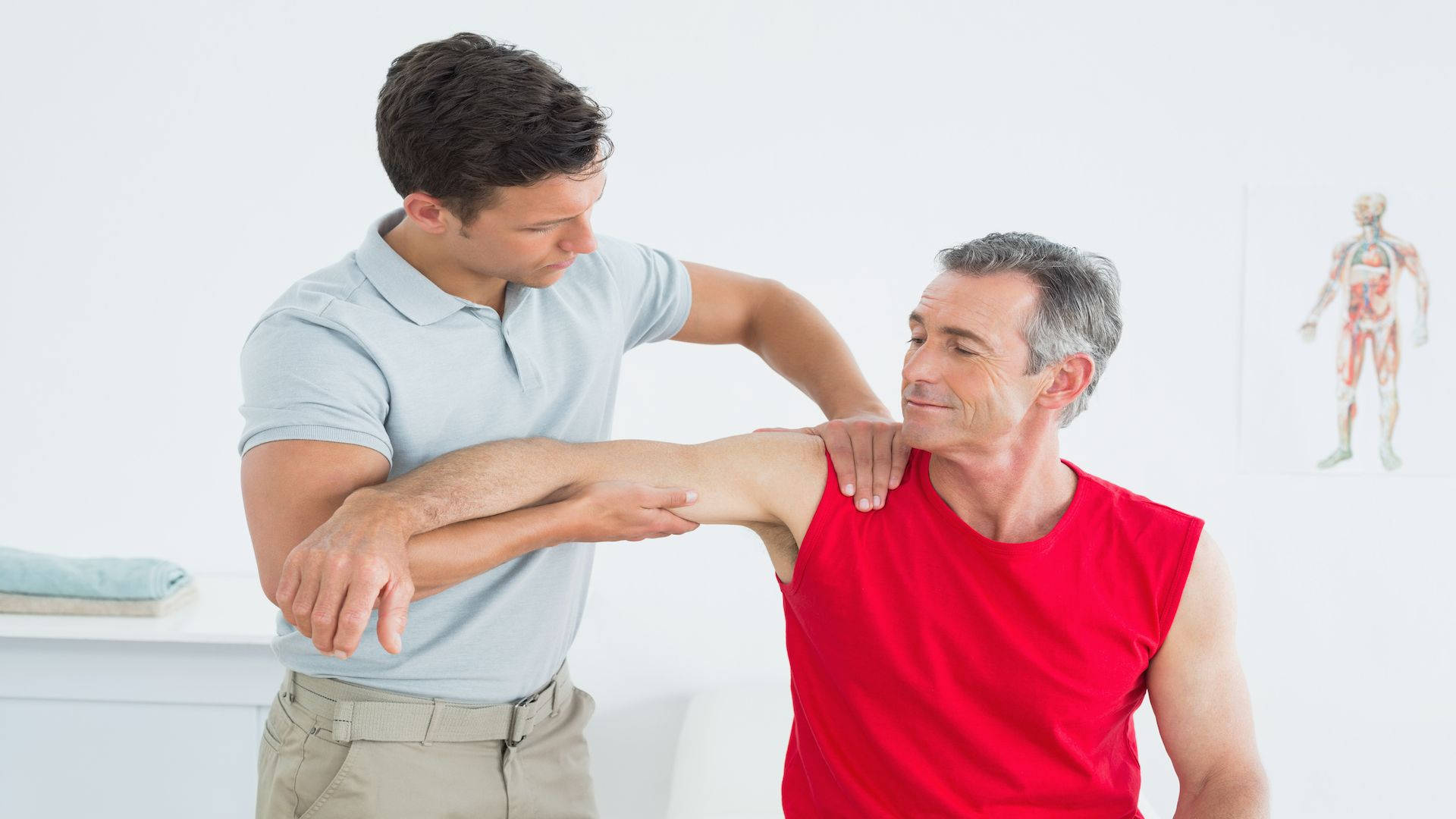 Professional Therapist Performing Massage Therapy On Patient