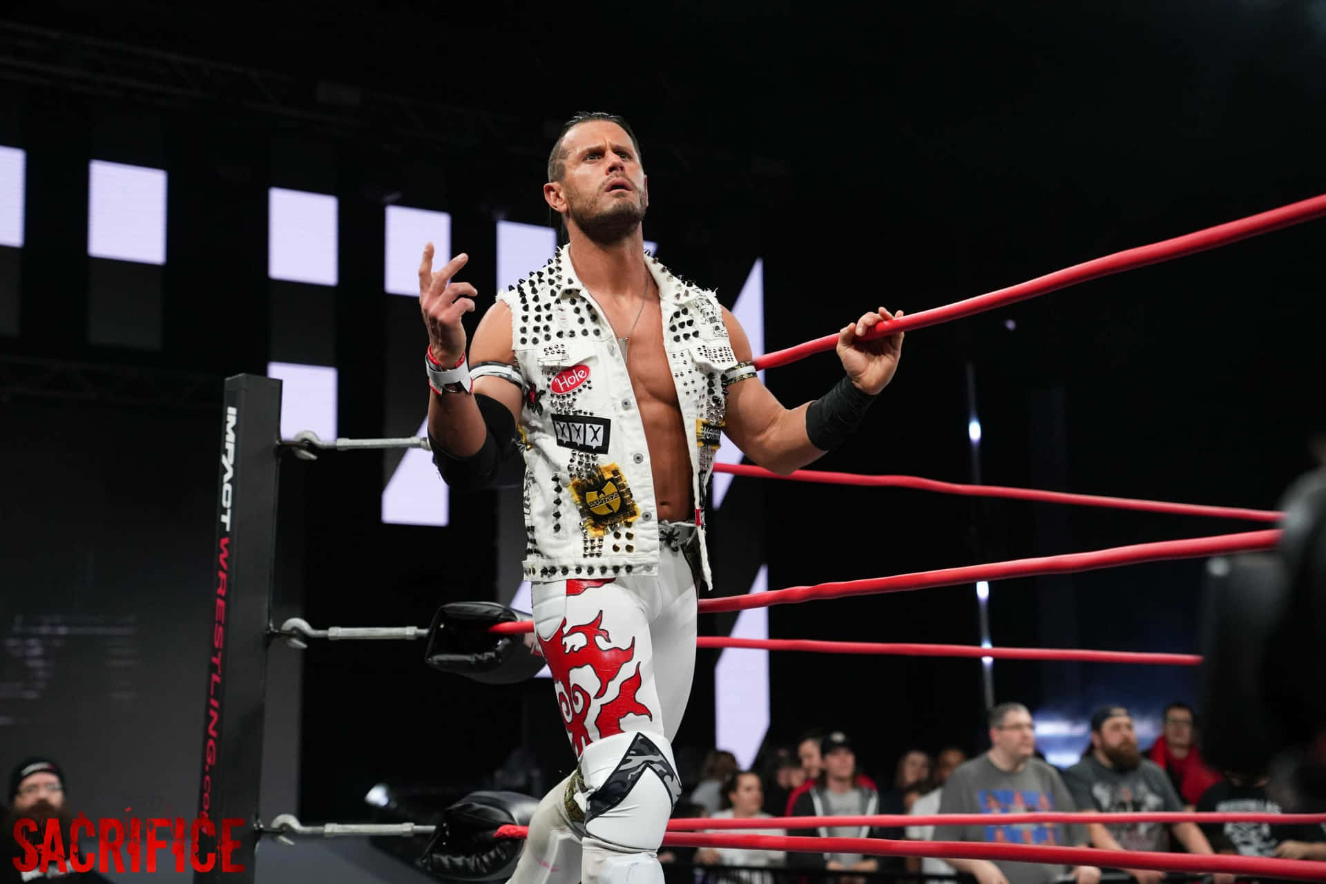 Professional Wrestler Alex Shelley Making A Grand Entrance At Impact Wrestling Sacrifice Background