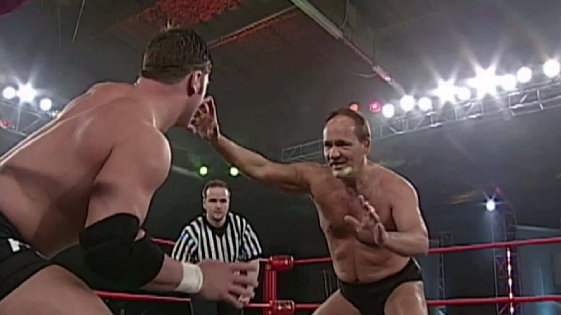 Professional Wrestler Larry Zbyszko Against Aj Styles Background