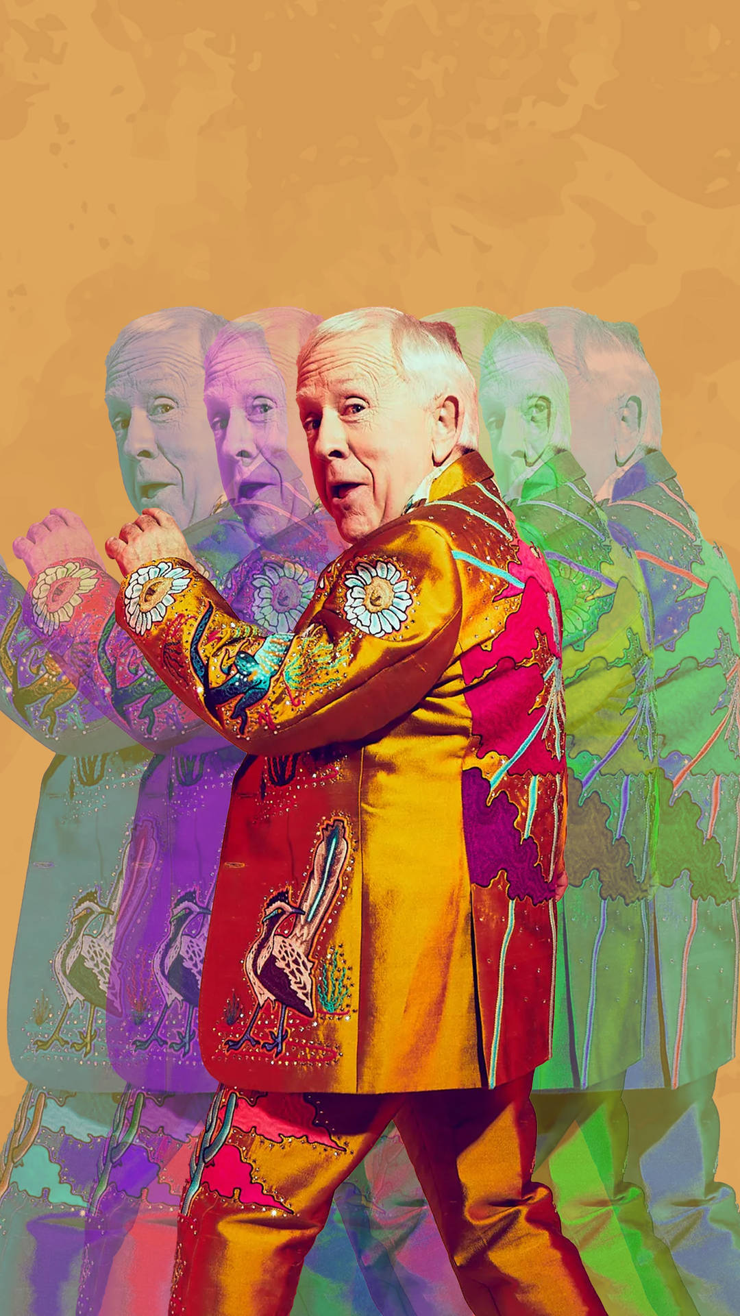 Prolific Actor Leslie Jordan Posing Elegantly Against A Multicolored Backdrop. Background