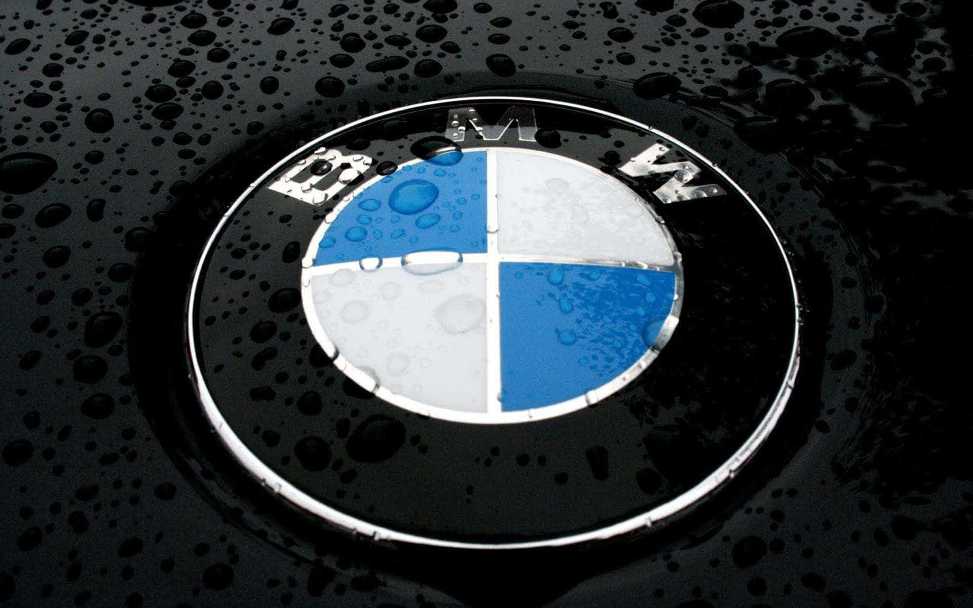 Prominent Bmw Logo On A Grey Background Background