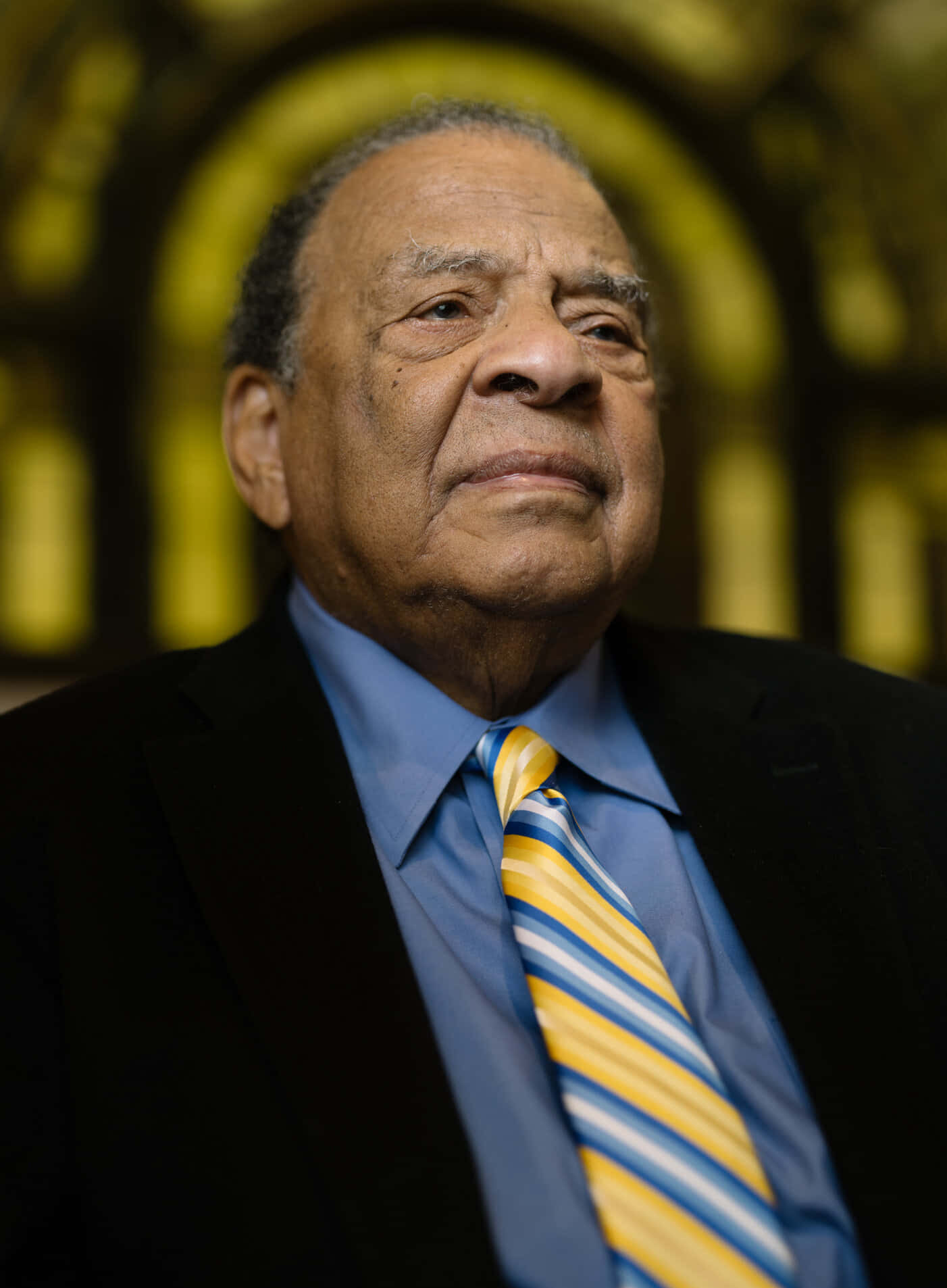 Prominent Civil Rights Activist Andrew Young Reflecting In Church Background