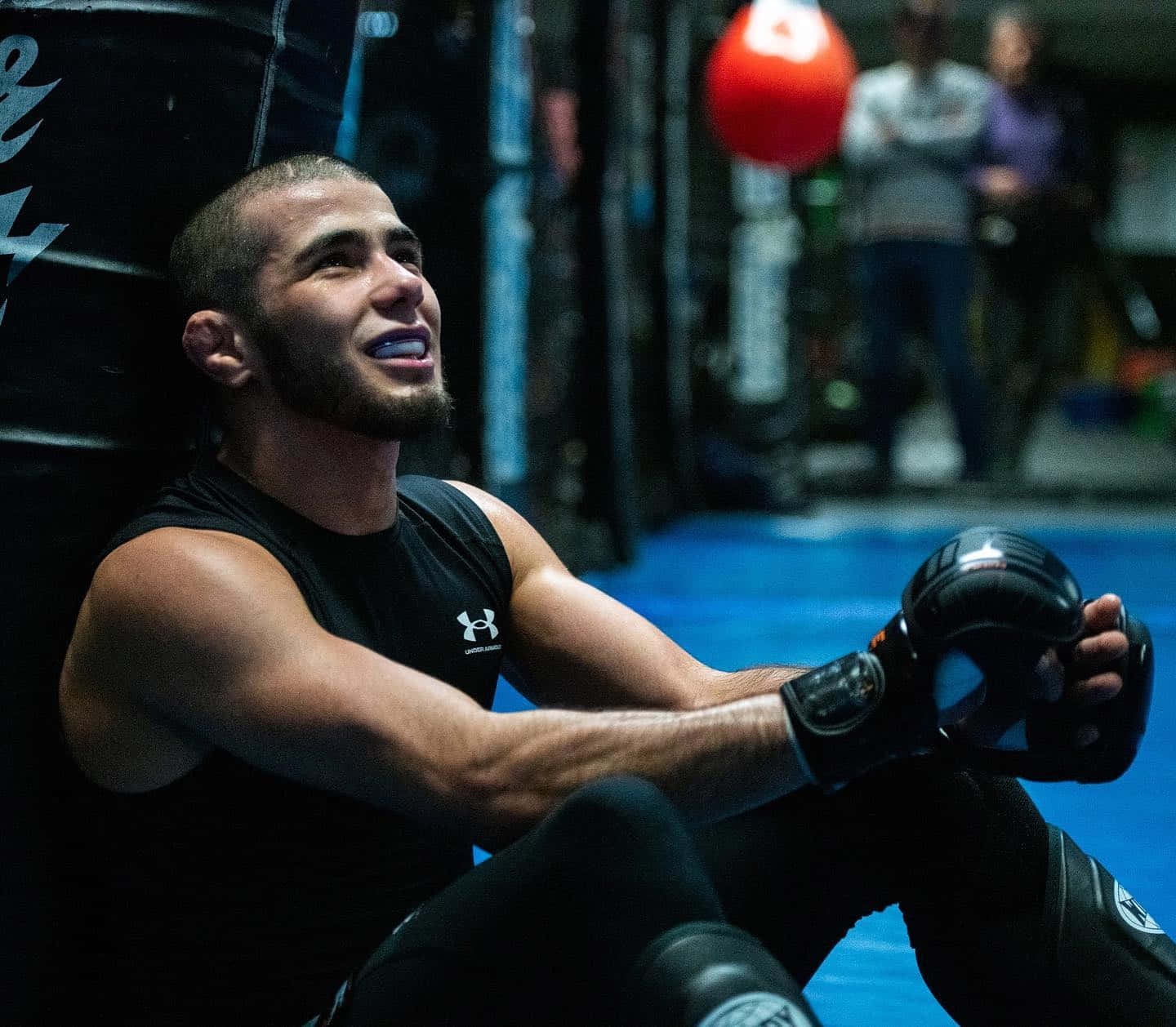 Prominent Mma Fighter, Muhammad Mokaev In Deep Thought During Training Background