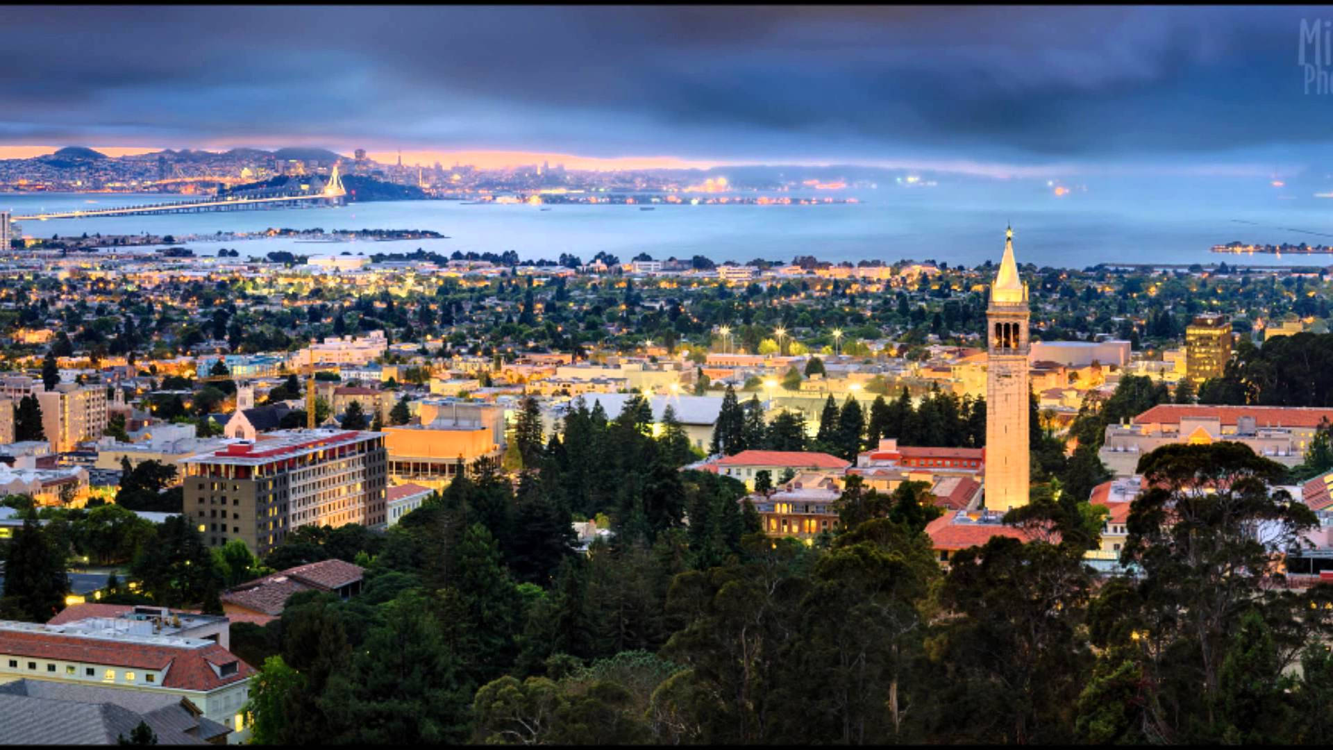 Prominent Sather Tower Dominating The Scenic Ucb Campus Background