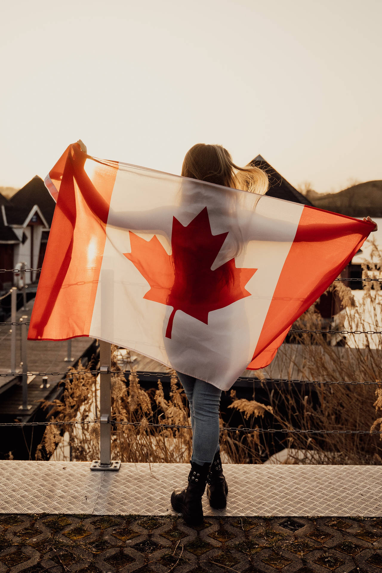 Proud Canadian Woman Holding National Flag Background