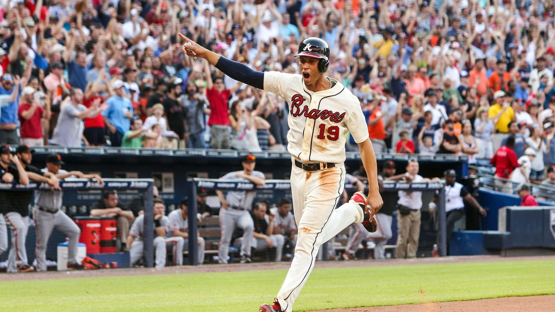 Proud Georgia Fan Waves Atlanta Braves Flag Background