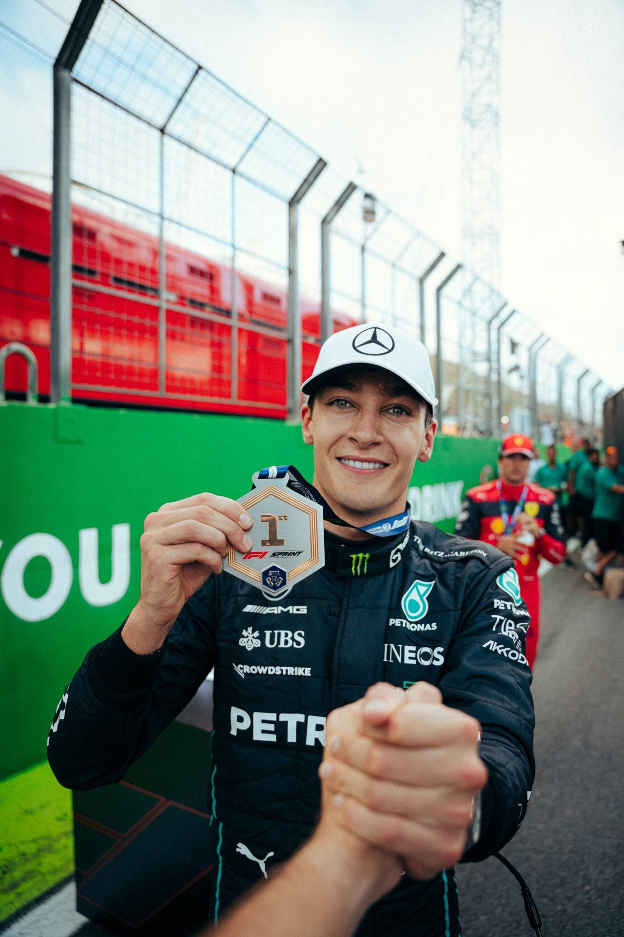 Proud Moment With George Russell Holding A Medal