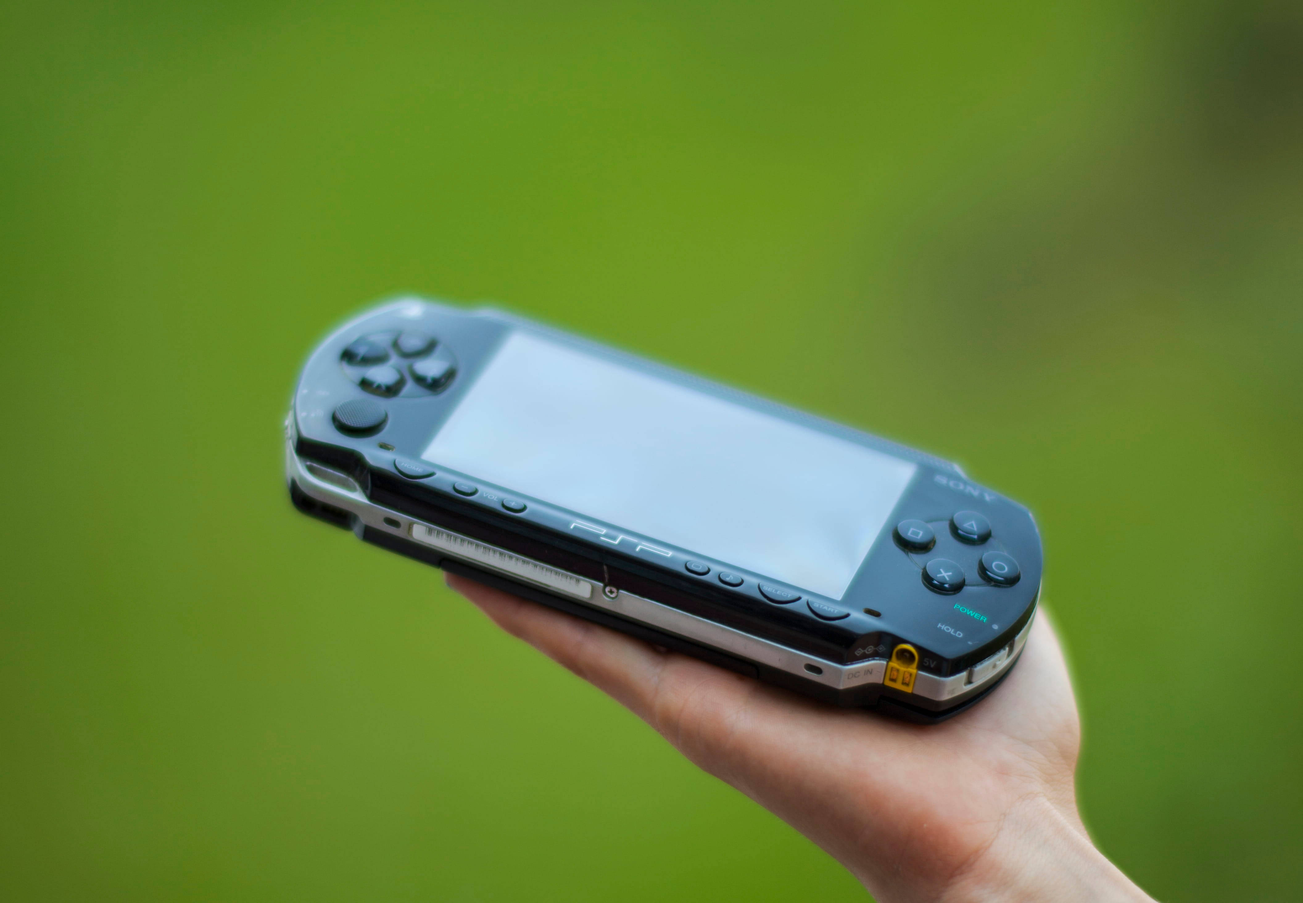 Psp On Someone's Hand Background