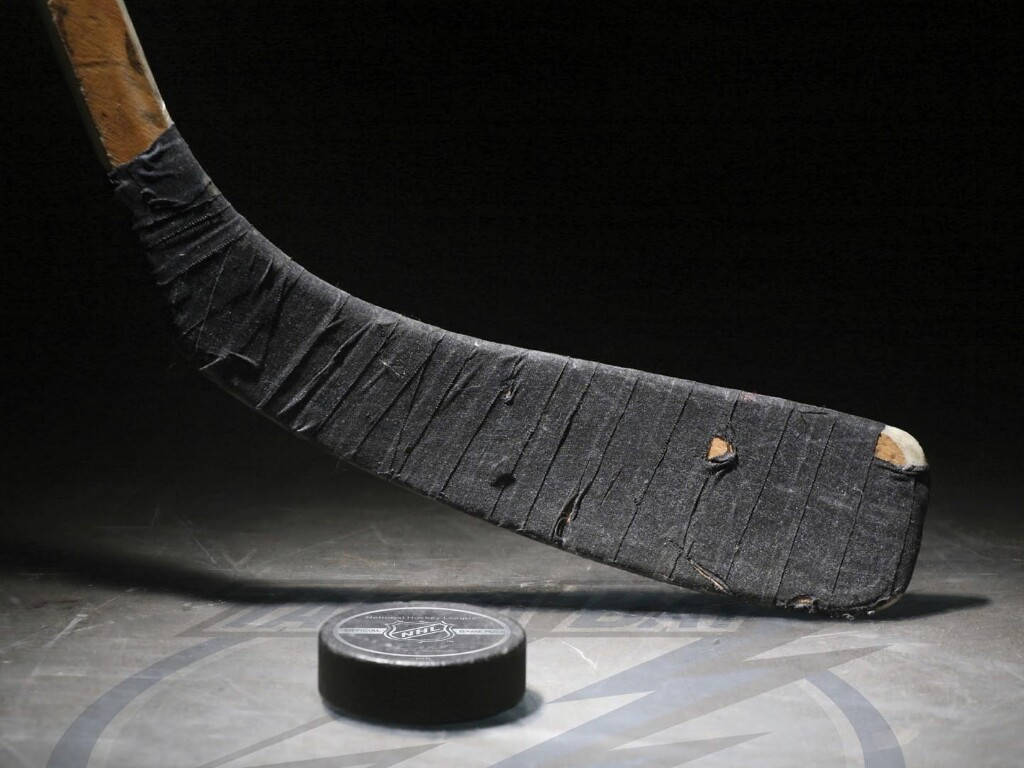Puck With Stick Ice Hockey Background