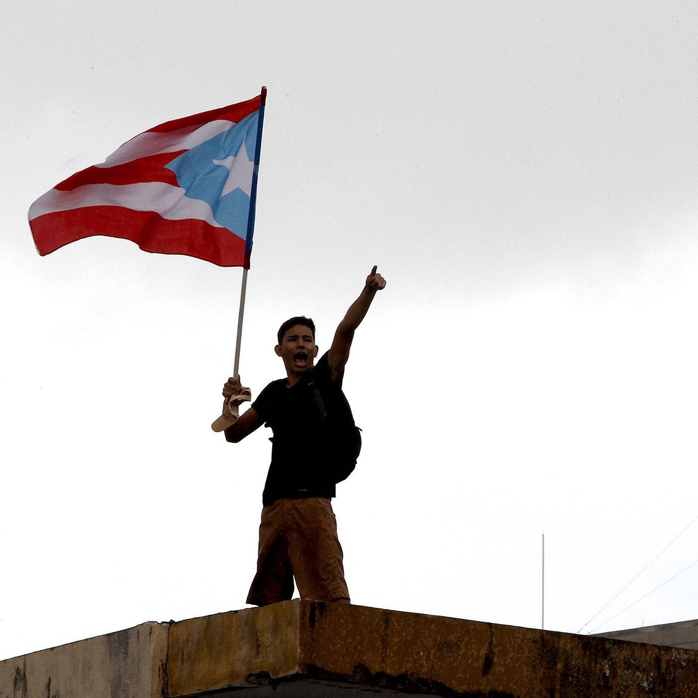 Puerto Rican Flag Hold By Teen