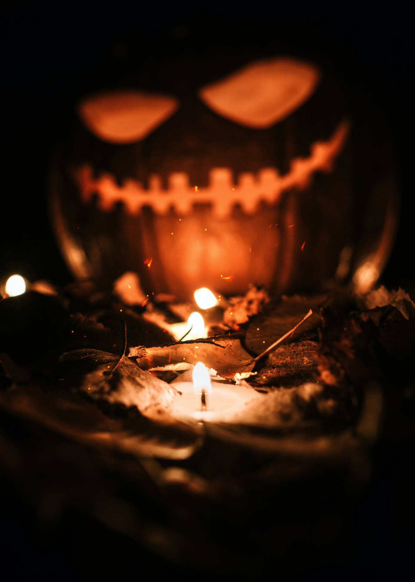 Pumpkin With Lit Candle Halloween Phone Background
