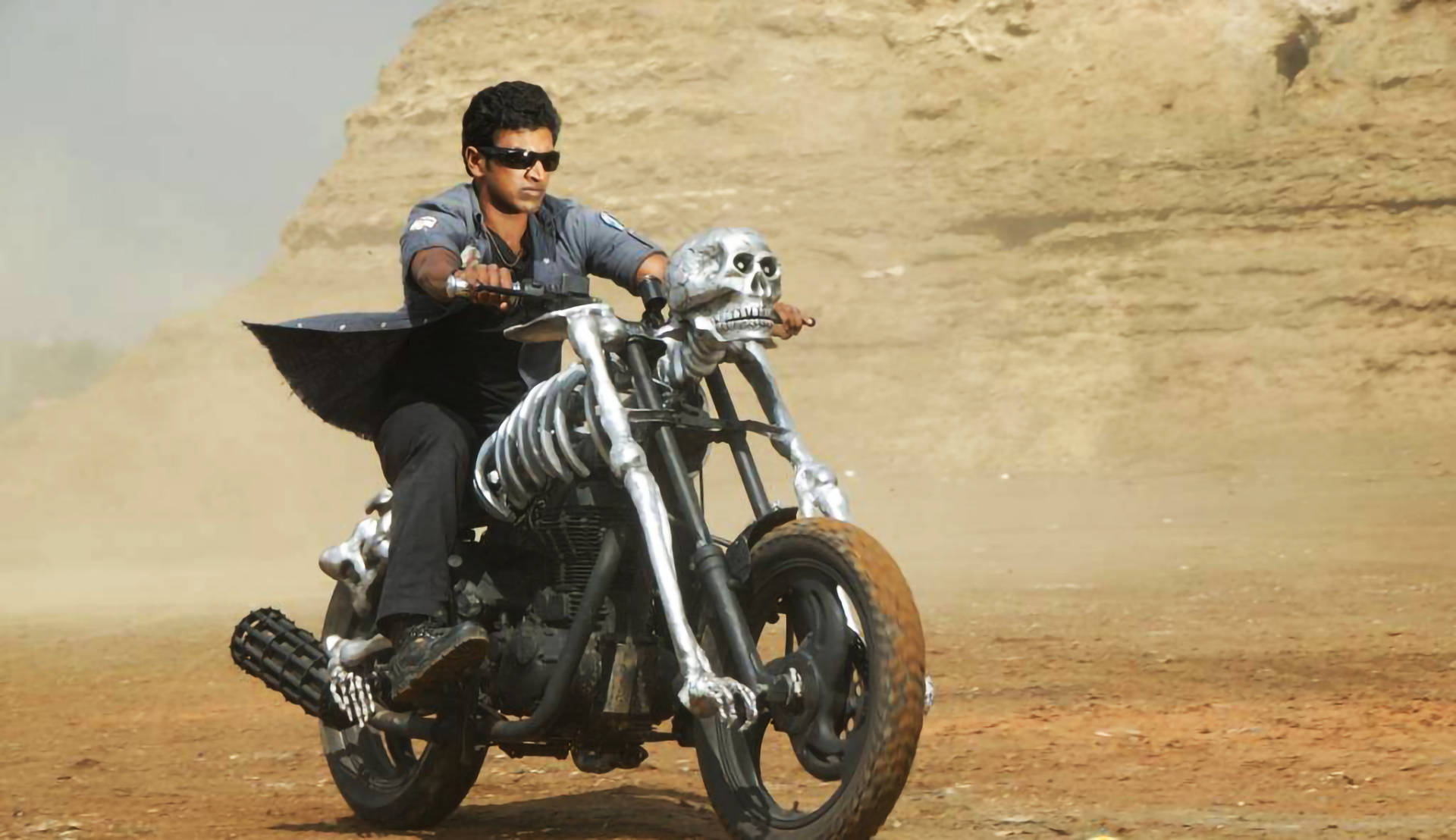 Puneeth Rajkumar Skeleton Motorcycle Desert Background