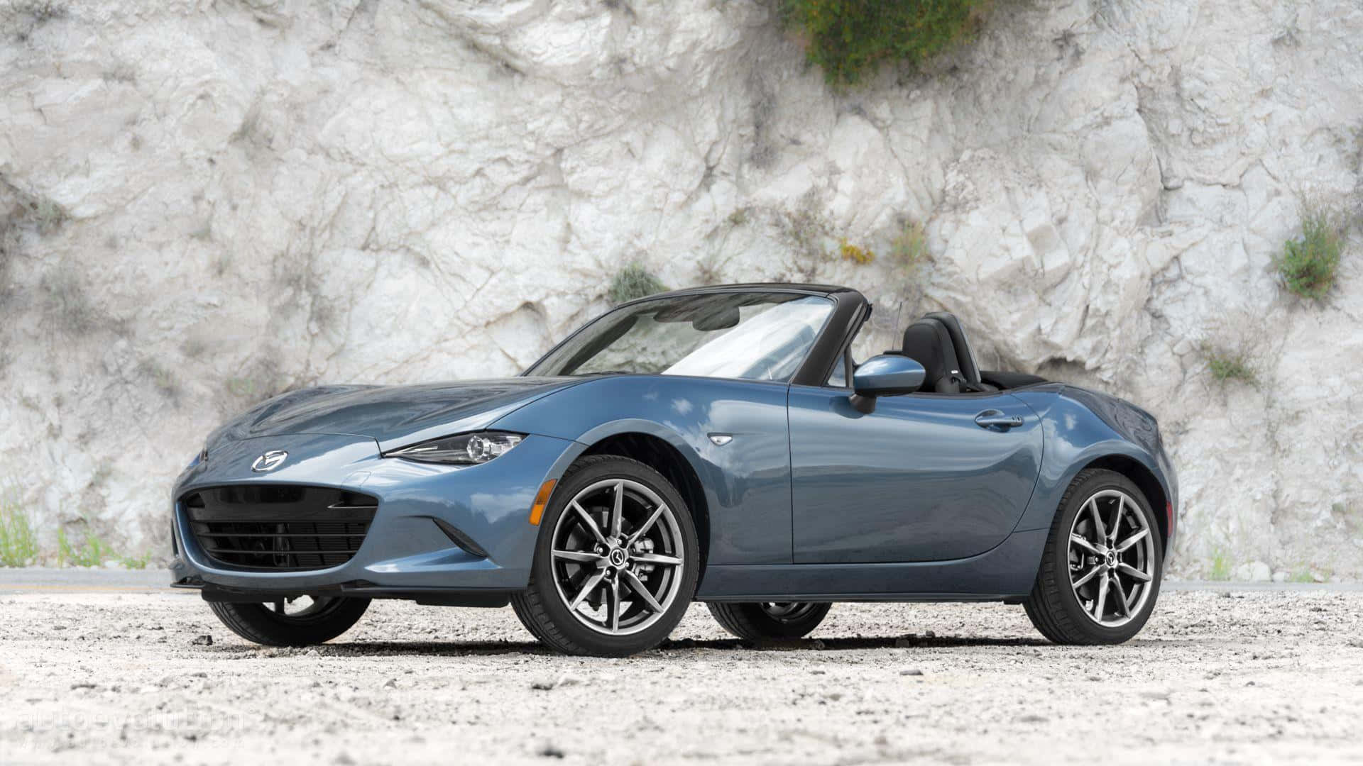 Pure Driving Fun Awaits In The Mazda Miata Background