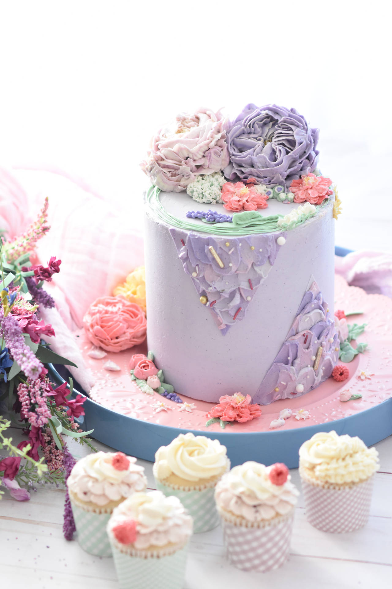 Purple Floral Cake And Cupcakes Background