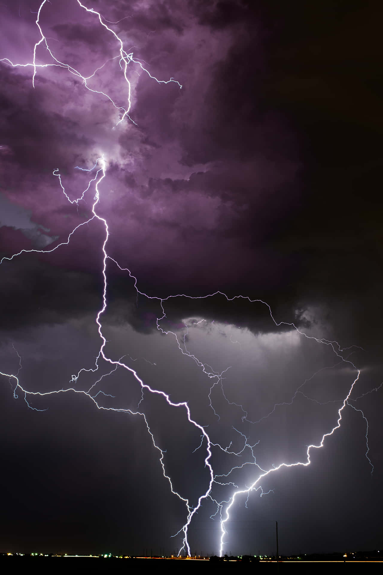 Purple Lightning In Dark Sky Background