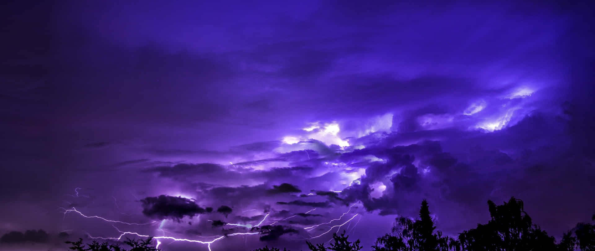 Purple Lightning In Vibrant Sky Background