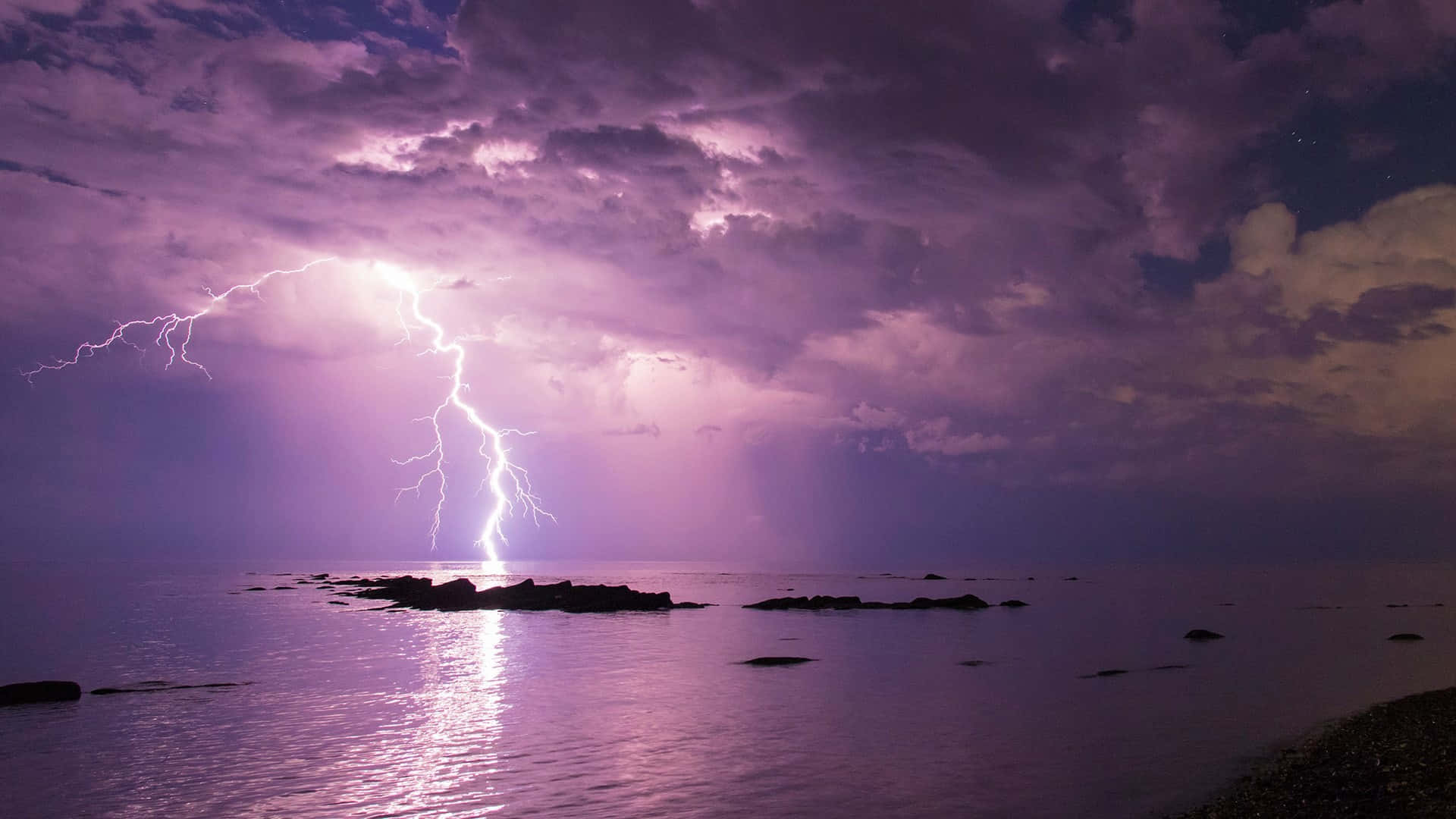 Purple Lightning Over Water Background