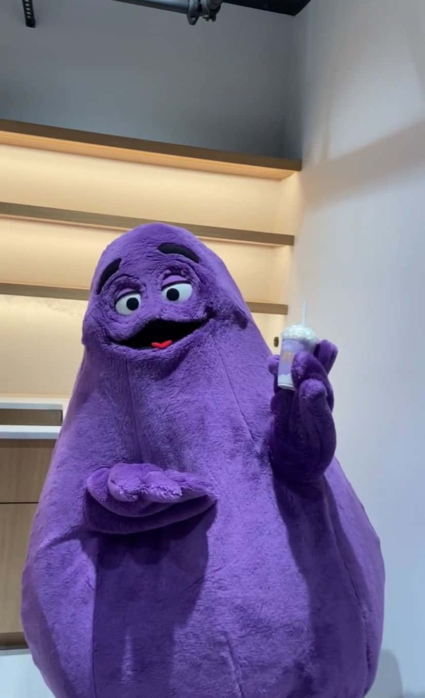 Purple_ Mascot_ With_ Drink.jpg Background