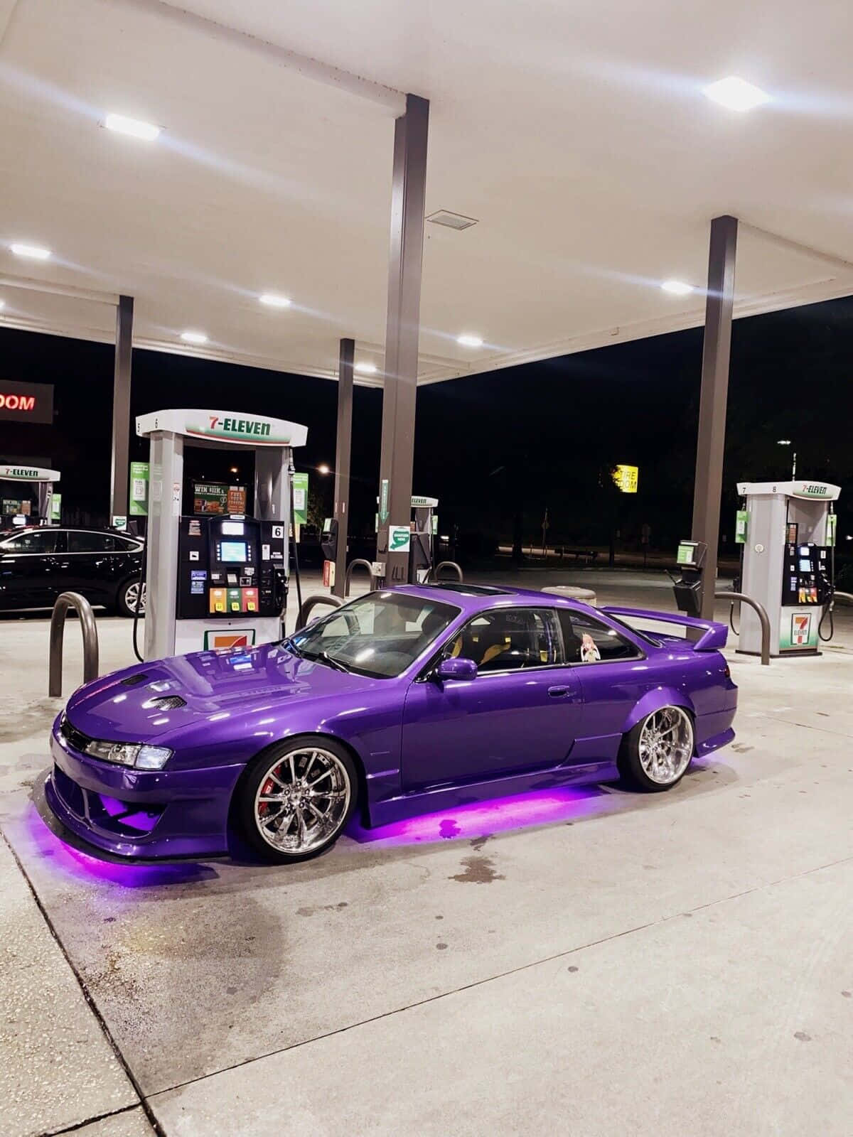 Purple Nissan240sxat Gas Station Background